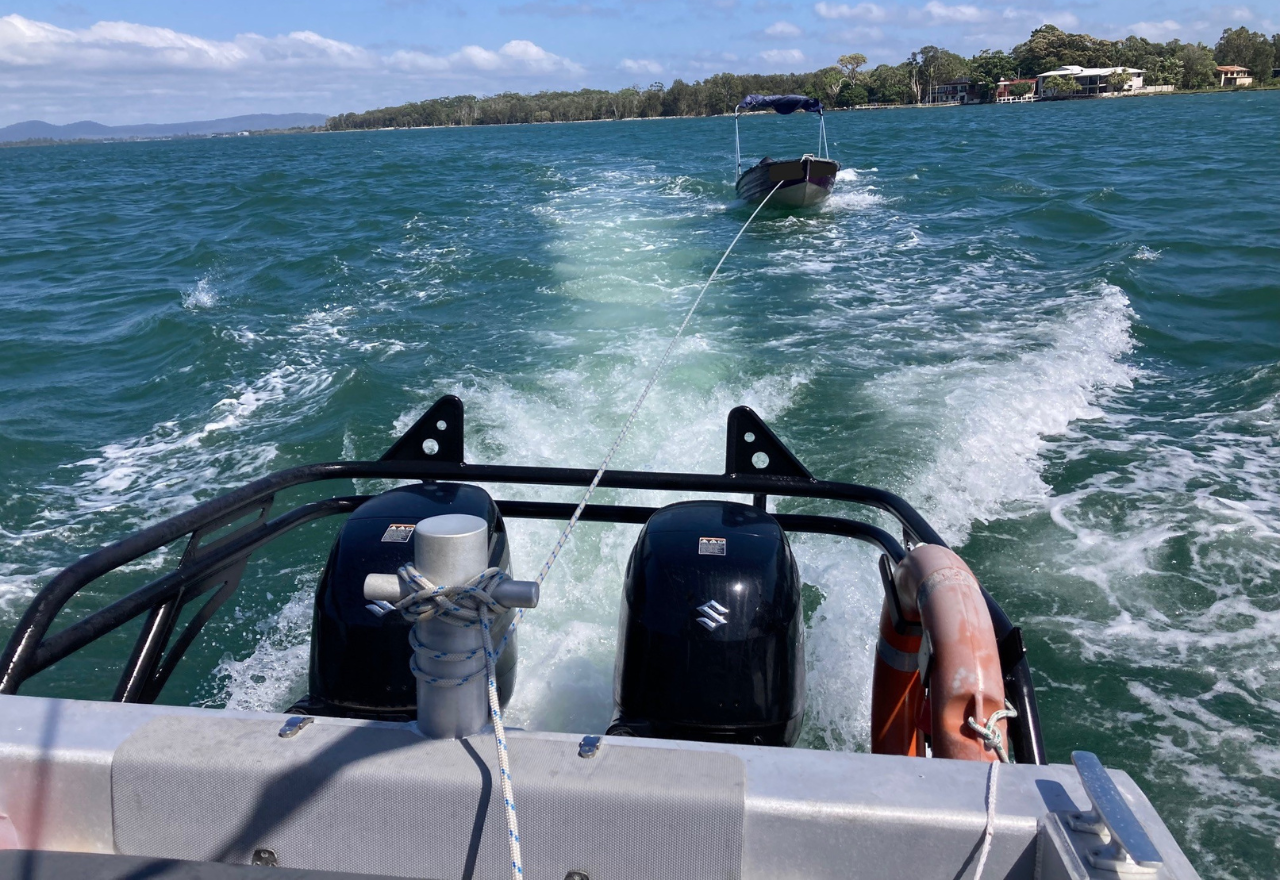 Marine Rescue Iluka Yamba crew rescue man from Clarence River after boat overturns