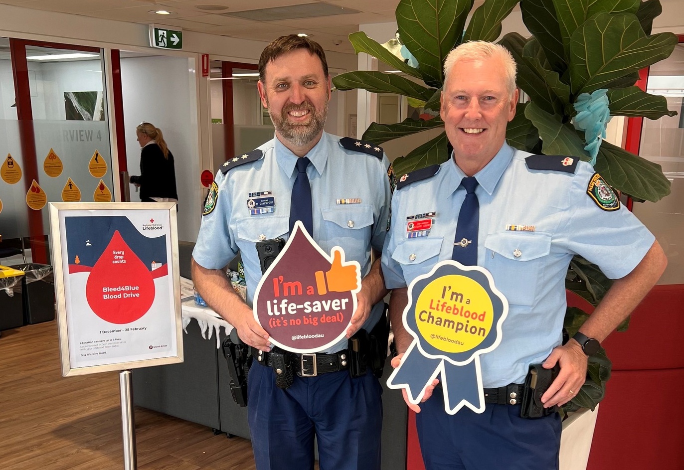 Police rolling up a sleeve for Bleed4Blue blood drive